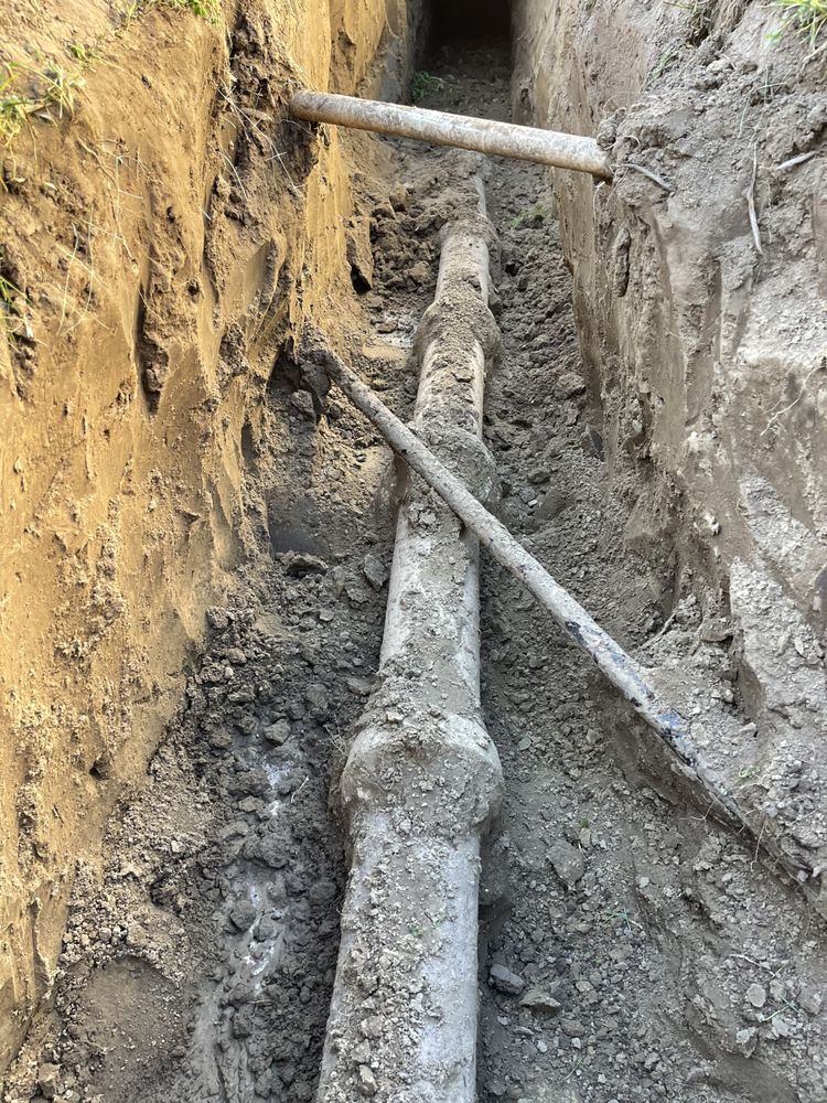 Buried line exposed in a trench